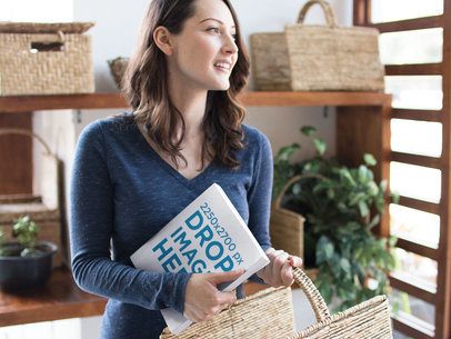 Pretty Woman Holding a Book and a Basket While at the Grocery Store Mockup a14429