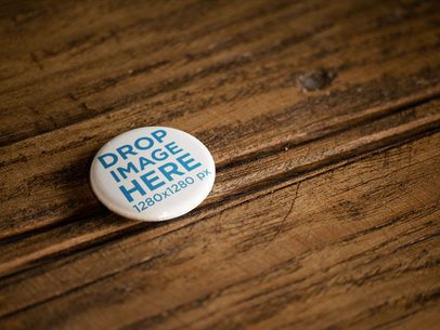 Button Lying on a Wooden Surface Mockup