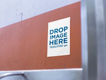 Poster on a White and Orange Wall Near a Bus Stop Mockup a14417