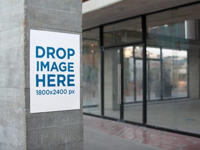 Poster on a Concrete Column Next to Stores for Rent Mockup