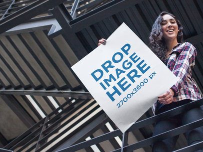 Young Woman Showing a Big Poster From Above Mockup