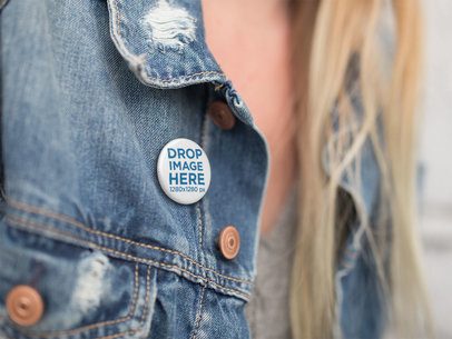 Mockup of a Woman Wearing a Denim Jacket With a Button Near the Neck