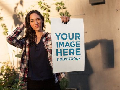 Young Hispanic Woman Winking While Holding a Poster