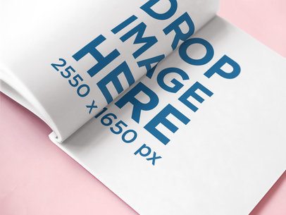 Open Magazine Lying on a Pink Surface Mockup
