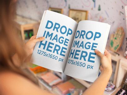 Over Shoulder Template of a Girl Holding a Magazine While Inside a Small Store a14408