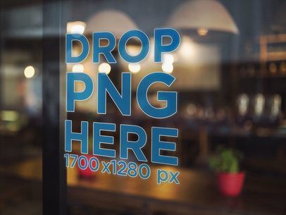 Angled Window Decal Mockup With a Wooden Table and Red Pots on the Background a14524