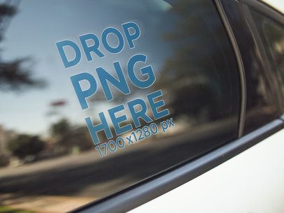 Mockup of a Window Decal on the Back Left Door of a White Car a14440