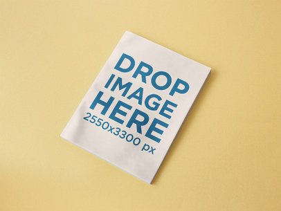 Magazine Lying on a Yellow Surface Mockup