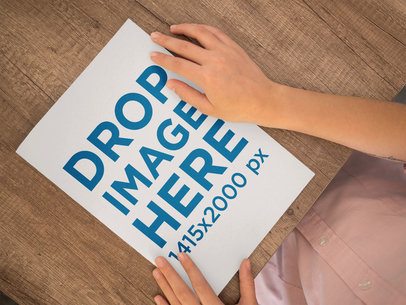 Mockup of a Woman With a Catalog On a Wooden Surface