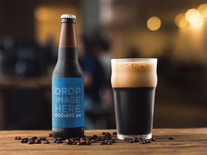 Mockup of a Stout Beer Bottle With a Glass Besides It