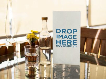 Booklet Menu Standing on a Small Dining Restaurant Table Mockup