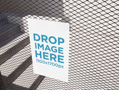 Vertical Poster on a Metal Grid Near a Concrete Stairway Template a14623