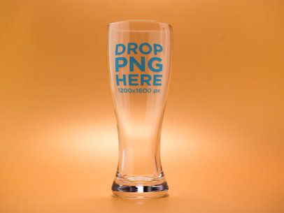 Mockup of an Empty Weizen Beer Glass Against an Orange Background
