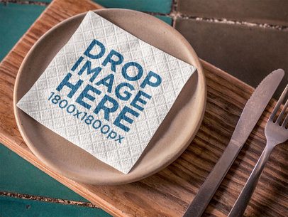 Napkin Template on a Plate With Cutlery Besides