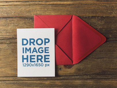 Invitation Template on a Red Envelope over a Wooden Table