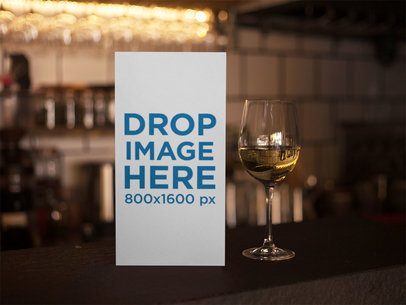 Standing Menu Template Inside a Bar With a Glass of White Wine Beside it a14766