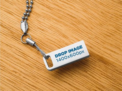 Metallic USB Flash Drive Mockup With Chain On a Wooden Surface a6539