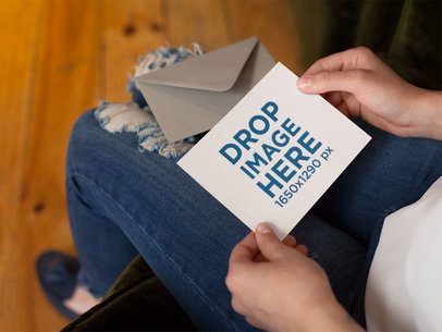 Woman Reading an Invitation Mockup While Sitting Down