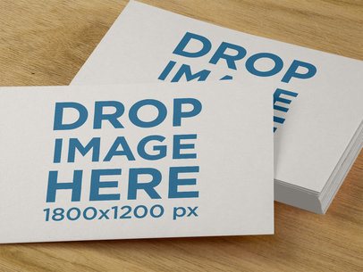 Close Up Template of a Pile of Postcards Lying on a Wooden Surface a14702