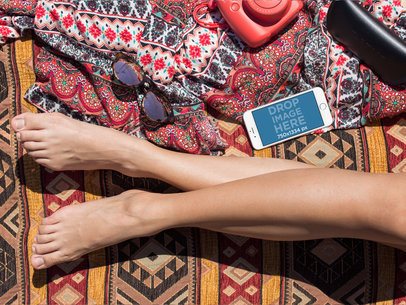 Mockup of a White iPhone 6 Lying Near a Woman Legs in Landscape Position a14293