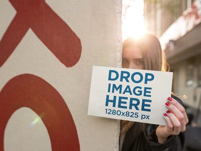 Blonde Woman Holding a Horizontal Flyer While in the Street 
