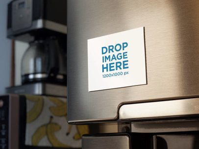 Fridge Magnet Mockup With a Coffee Machine and Bananas Print in the Back