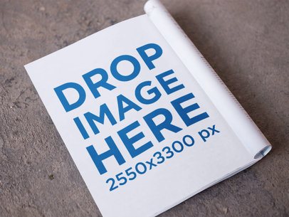 Open Magazine Template Lying on the Concrete Floor