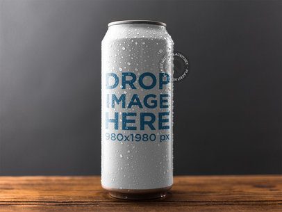 Wet Can Template Standing on a Wooden Surface Against a Gray Background