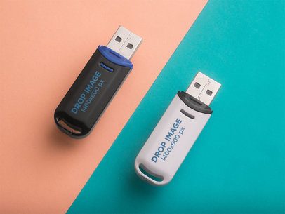 Pair of USB Flash Drives Mockup Lying on Turquoise and Orange Surfaces a6536