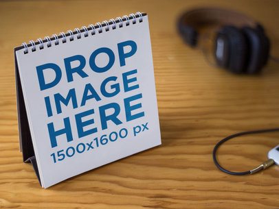 Calendar Template On a Wooden Table Near Headphones