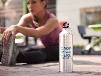 Young Hispanic Woman Doing Exercises With an Aluminum Water Bottle Template Standing Near Her