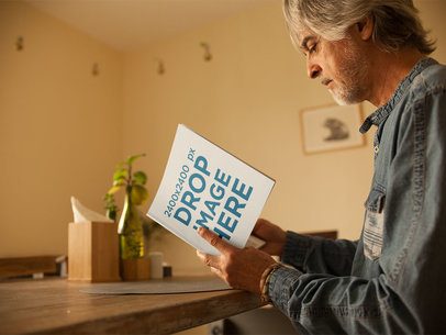 Elder Man Reading a Square Book Mockup in the Morning