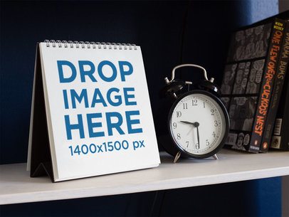 Calendar Mockup Standing With a Clock and Books Beside It