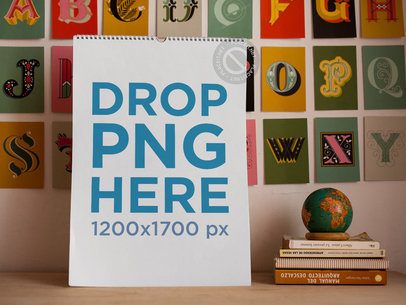 Front Mockup of a Calendar Standing Near Books and Small Globe
