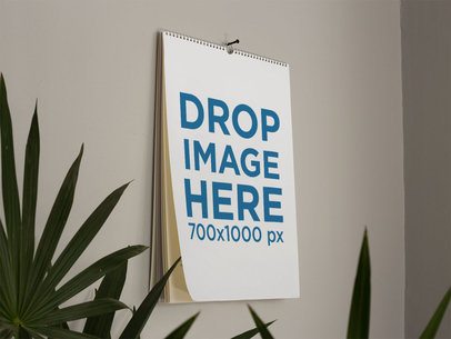 Catalog Mockup on a Wall with Plants in Front of it