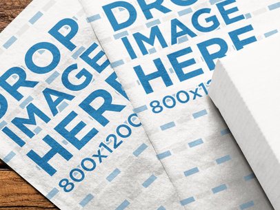 Pair of Wrapping Papers Mockup Lying Together on a Wooden Surface