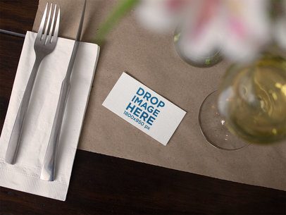 Business Card Mockup Lying on a Restaurant Table
