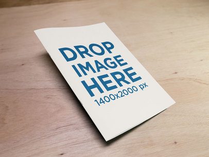 Big Catalog Mockup Lying on a Wooden Table
