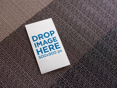 Vertical Business Card Mockup Lying on a Brown Grayscale Surface a15023