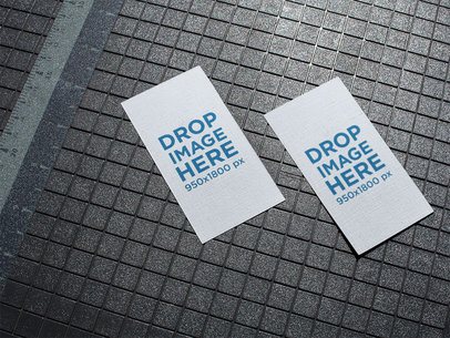 Pair of Vertical Business Cards Mockup Lying on a Patterned Floor a15010
