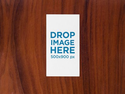 Vertical Business Card Mockup on a Wooden Surface