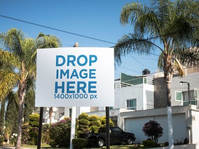 Real Estate Lawn Sign Standing on a House Garden