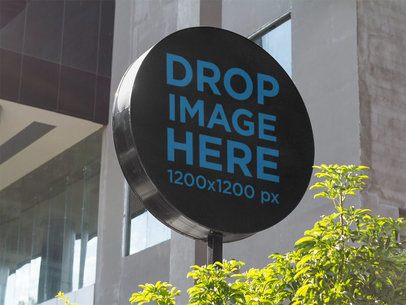 Round Sign Mockup in an Open Mall Outdoors