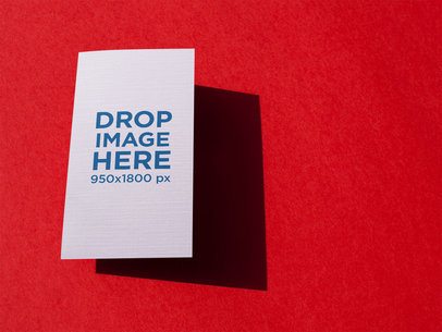 Vertical Business Card Template Floating Over a Red Surface