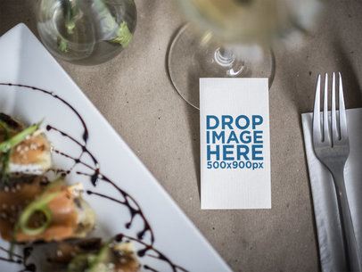 Vertical Business Card Mockup Next to a Gourmet Dish in a Restaurant a15034