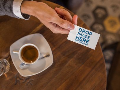 Business Man Handing a Business Card Template While at a Cafe a15029