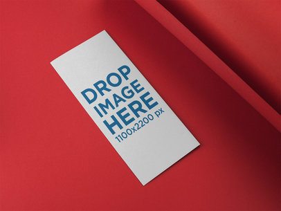 Trifold Brochure Mockup Lying on a Red Surface