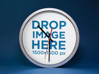 Mockup of a Round Clock Standing on a Blue Surface a15236