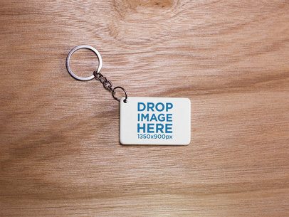Keychain Mockup Lying on a Wooden Surface